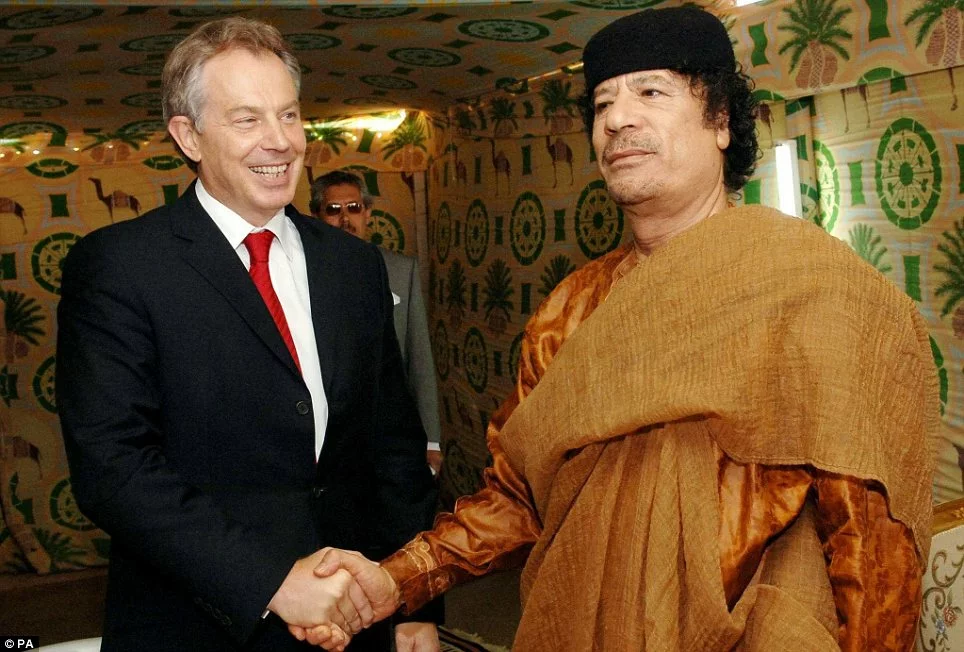 Paedophiles Roman Catholic Ex PM Tony Blair with Muammar Gaddafi who raped children