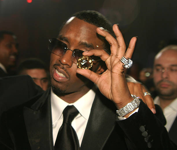 Paedophile P Diddy with the Freemason all seeing eye symbolism