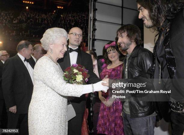 Alleged child abuser Russel Brand with Queen Elizabeth II