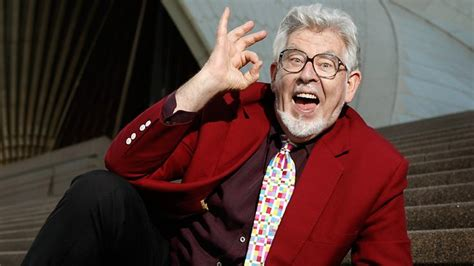 Paedophile Rolf Harris doing the 666 hand signs
